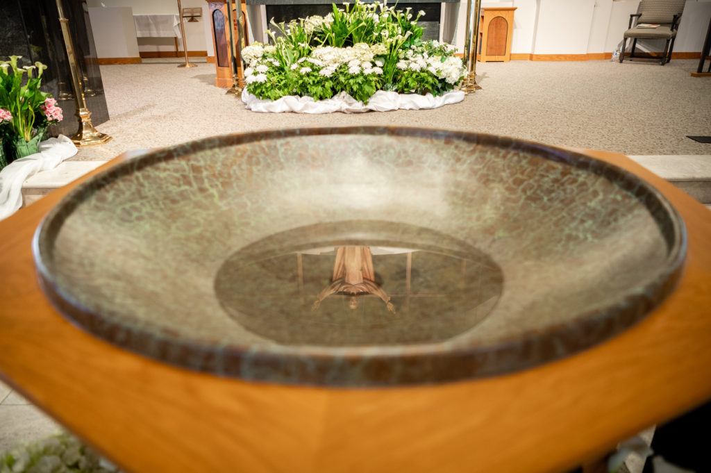 View of the holy water basin at the alter inside the chapel at St Andrew Catholic Church