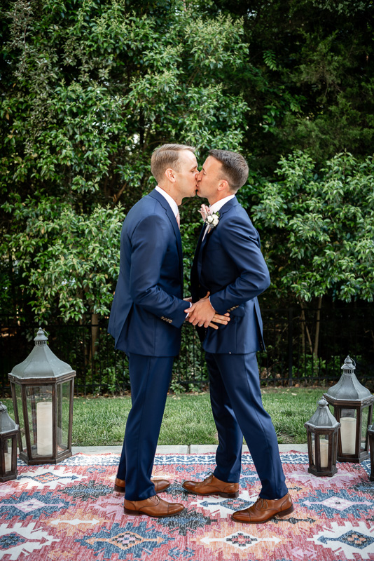 grooms first kiss at the alter in Charlotte North Carolina