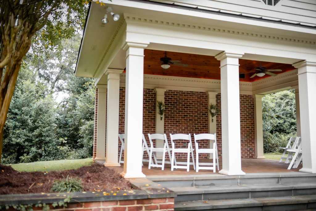 Poolhouse set up for ceremony at intimate, backyard wedding in Marietta GA