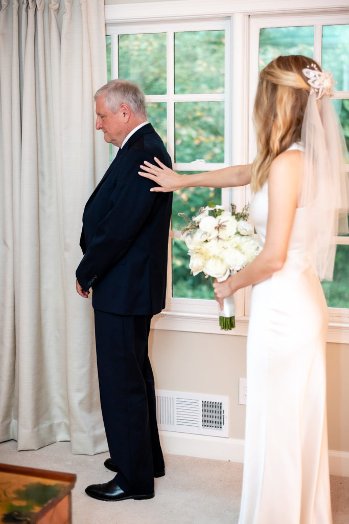 Bride and father or the bride first look at intimate, backyard wedding in Marietta GA