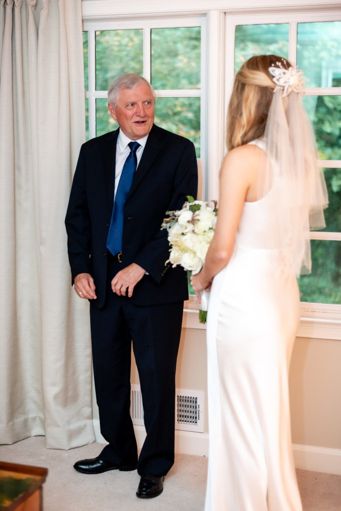 Bride's father's reaction when he sees her in her wedding dress at intimate, backyard wedding in Marietta GA