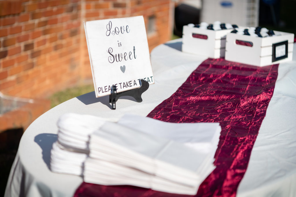 Guest favor table with hand sanitizer at wedding at The Gavi Estate and Barn in Forsyth GA