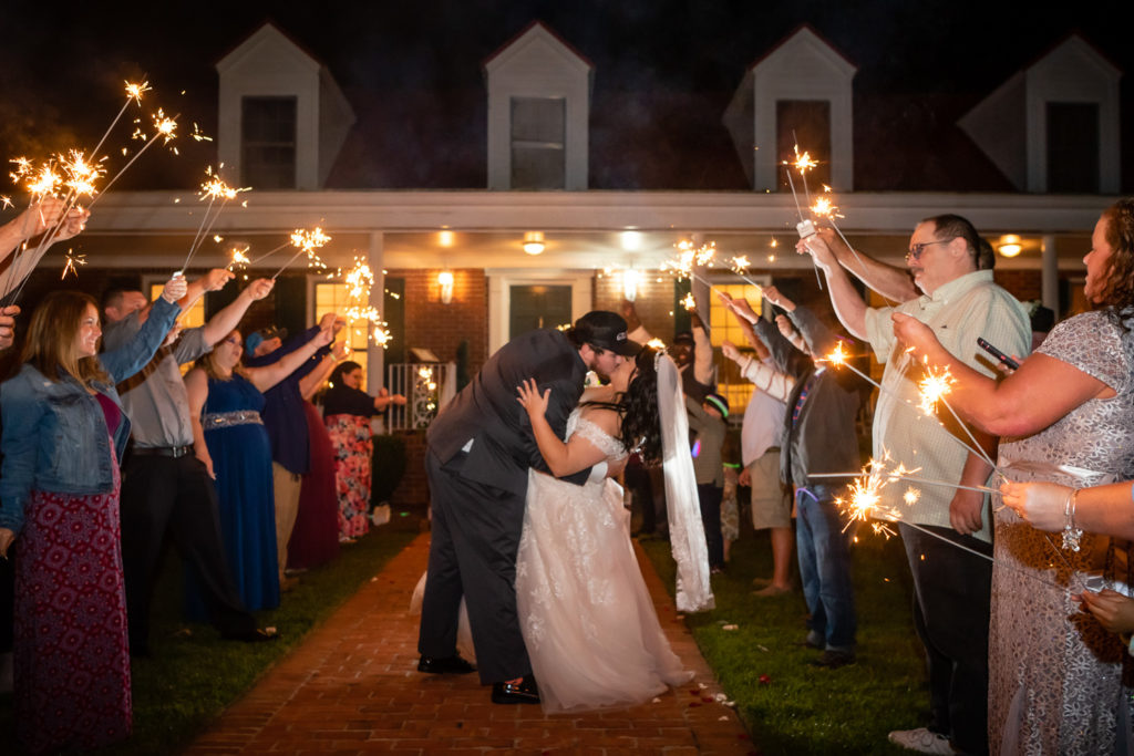 Sparkler exit for bride and groom in front of estate house at wedding at The Gavi Estate and Barn in Forsyth GA