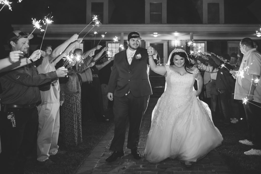 Sparkler exit for bride and groom in front of estate house at wedding at The Gavi Estate and Barn in Forsyth GA