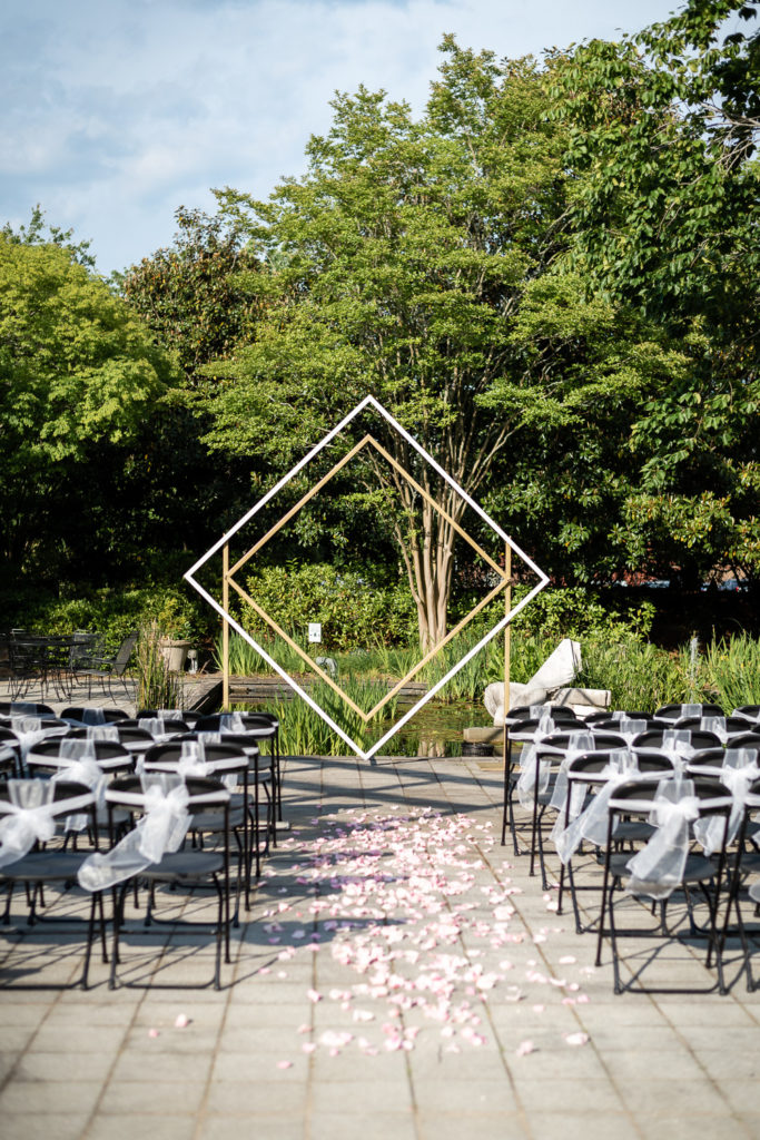 geometric arbor at ceremony site in the garden on the wedding day at The Hudgens Center for Art and Learning in Atlanta Georgia