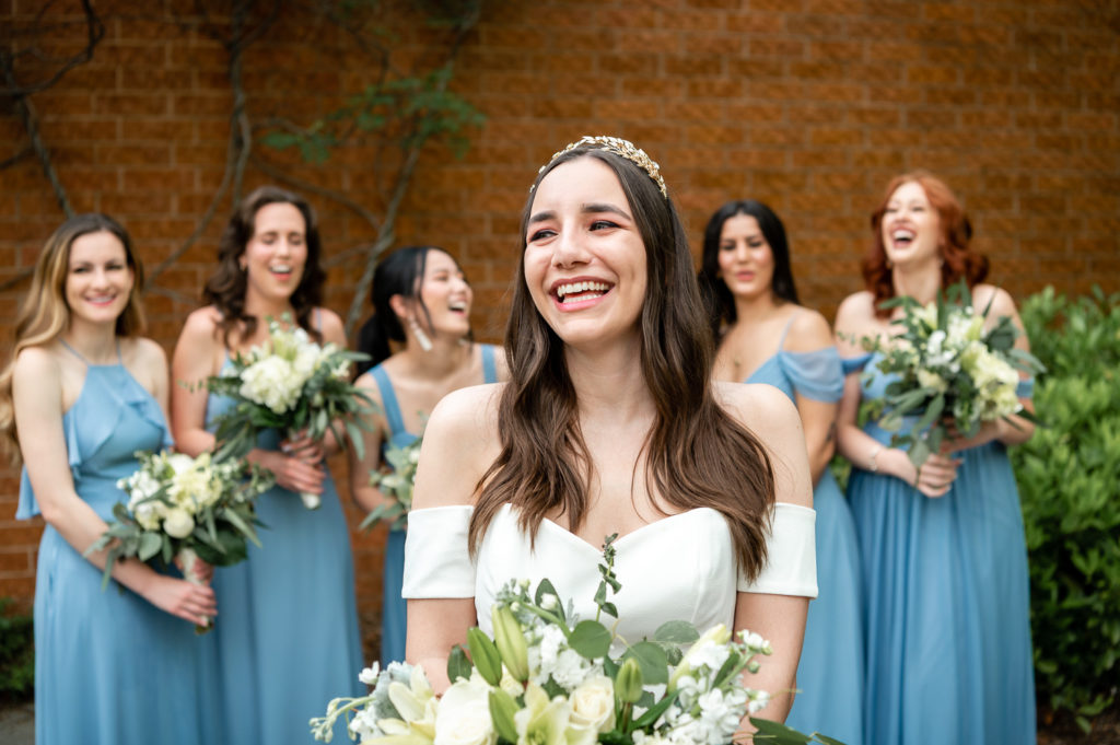 bridesmaids standing behind bride for photo on the wedding day at The Hudgens Center for Art and Learning in Atlanta Georgia