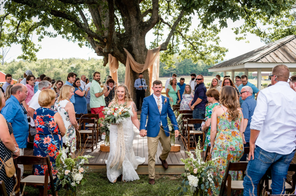 Classy boho wedding under giant oak tree on family property in Calhoun Georgia outside of Atlanta Georgia
