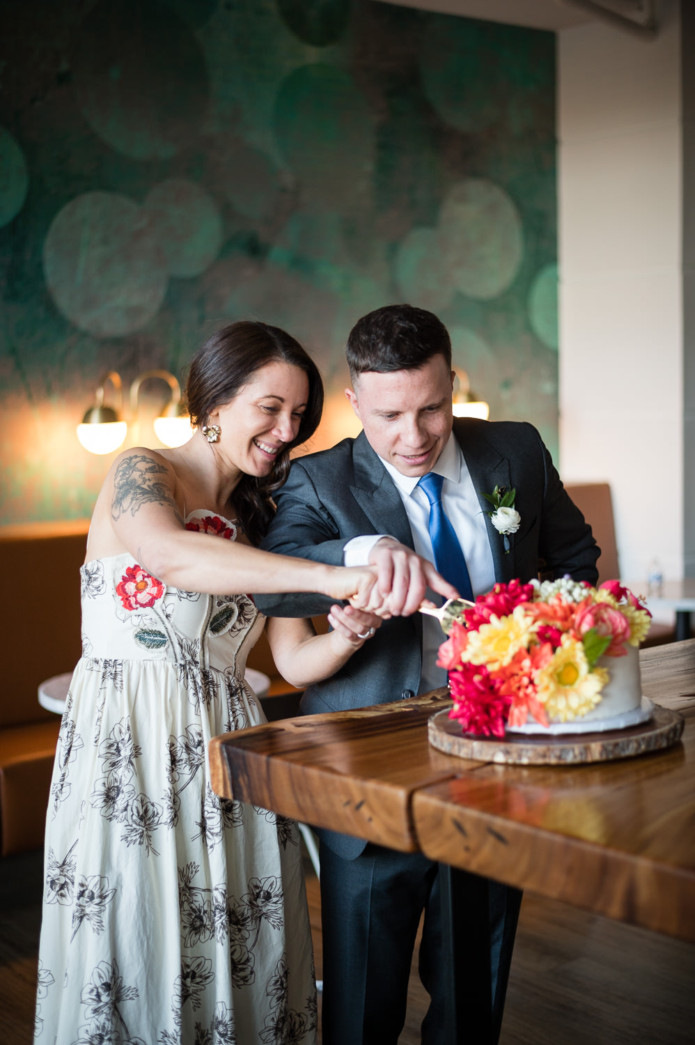 indoor reception with white floralsat surprise rooftop wedding in midtown atlanta