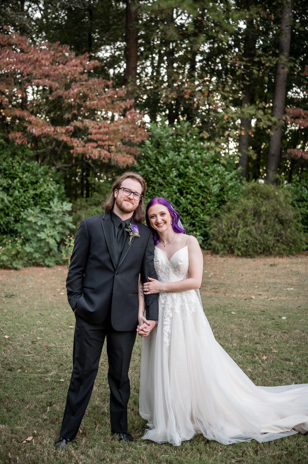 bride and groom cuddling for portrait at wedding at The Gardens at Kennesaw Mountain in Atlanta Georgia