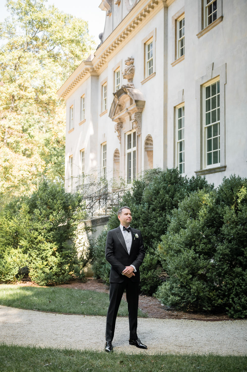 groom waiting for first look with bride wedding at The Swan House at the Atlanta History Center in Atlanta Georgia