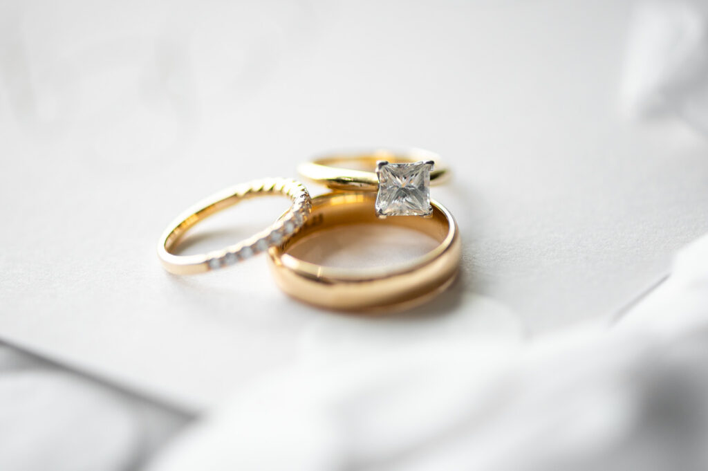 gold wedding band and engagement ring
